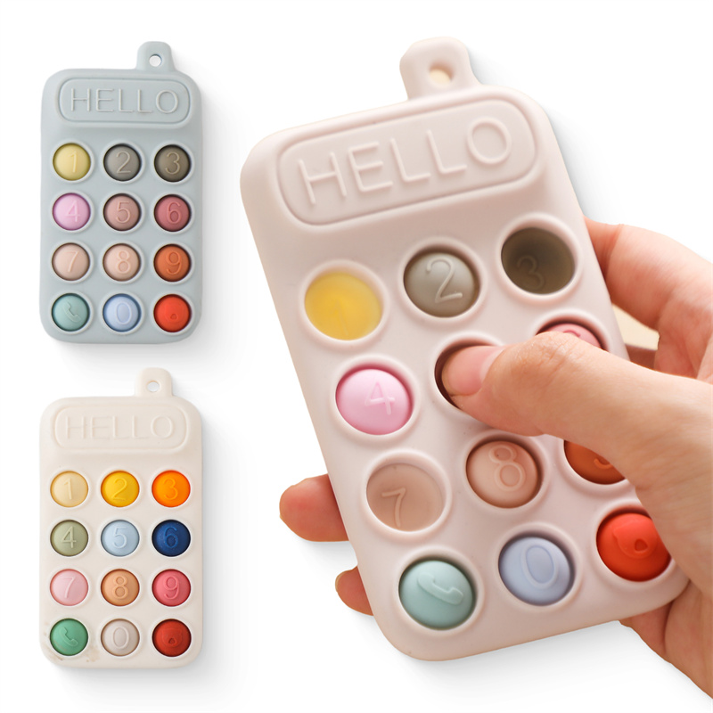 Baby Products Clicks - ของเล่นยางกัดโทรศัพท์มือถือซิลิโคนสำหรับเด็ก กดปุ่มมีเสียงคลิก ฝึกการรับรู้สีและตัวเลข พัฒนาทักษะการเคลื่อนไหวอย่างละเอียด ปลอดสาร BPA